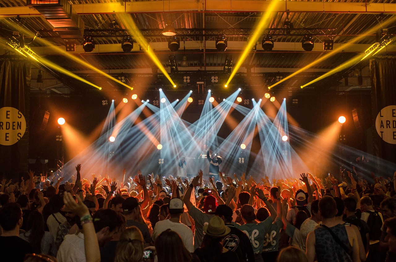 Live showcase performance on a stage with lights